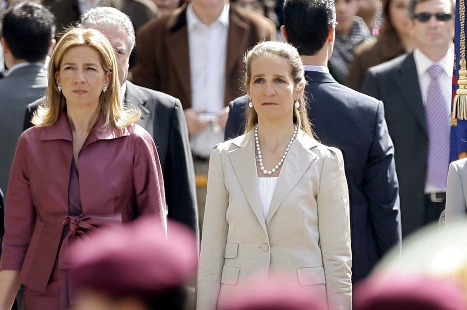 Spain's Princess Cristina (L) and Princess Elena, listen to the Spanish national anthem during a ceremony upon their arrival for the opening of the Spanish Parliament, April 16, 2008. (AP Photo)