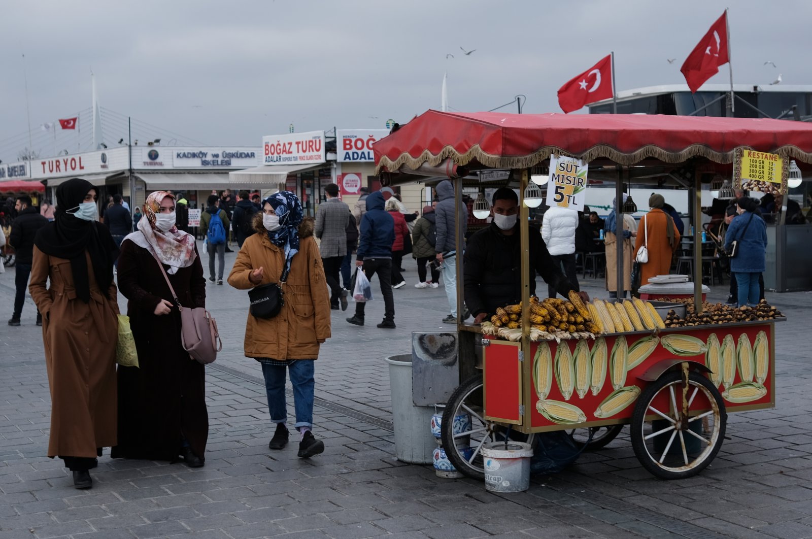 People wearing protective masks stroll at Eminönü district amid the COVID-19 pandemic, in Istanbul, Turkey March 3, 2021. (Reuters Photo)