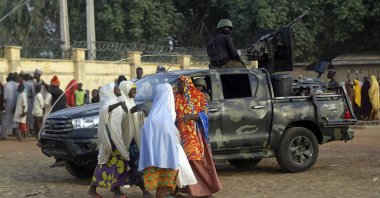 Parents are reunited with their daughters in Jangabe, Nigeria, Wednesday, March 3, 2021. (AP Photo)