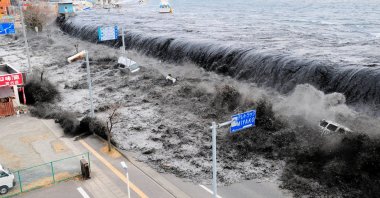 In this file photo a wave approaches Miyako City from the Heigawa estuary in Iwate Prefecture after the 8.9 magnitude earthquake struck the area on March 11, 2011. (Reuters)