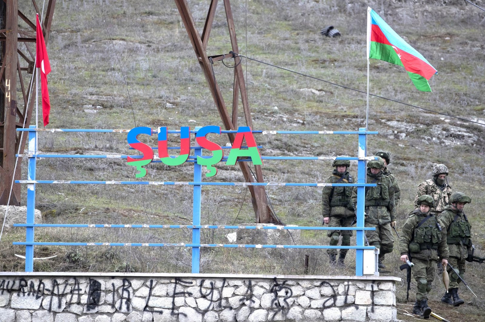 Russian peacekeepers and Azerbaijani servicepeople patrol the area at the entrance to the town of Shusha, Azerbaijan, Nov. 26, 2020. (Photo by Getty Images)