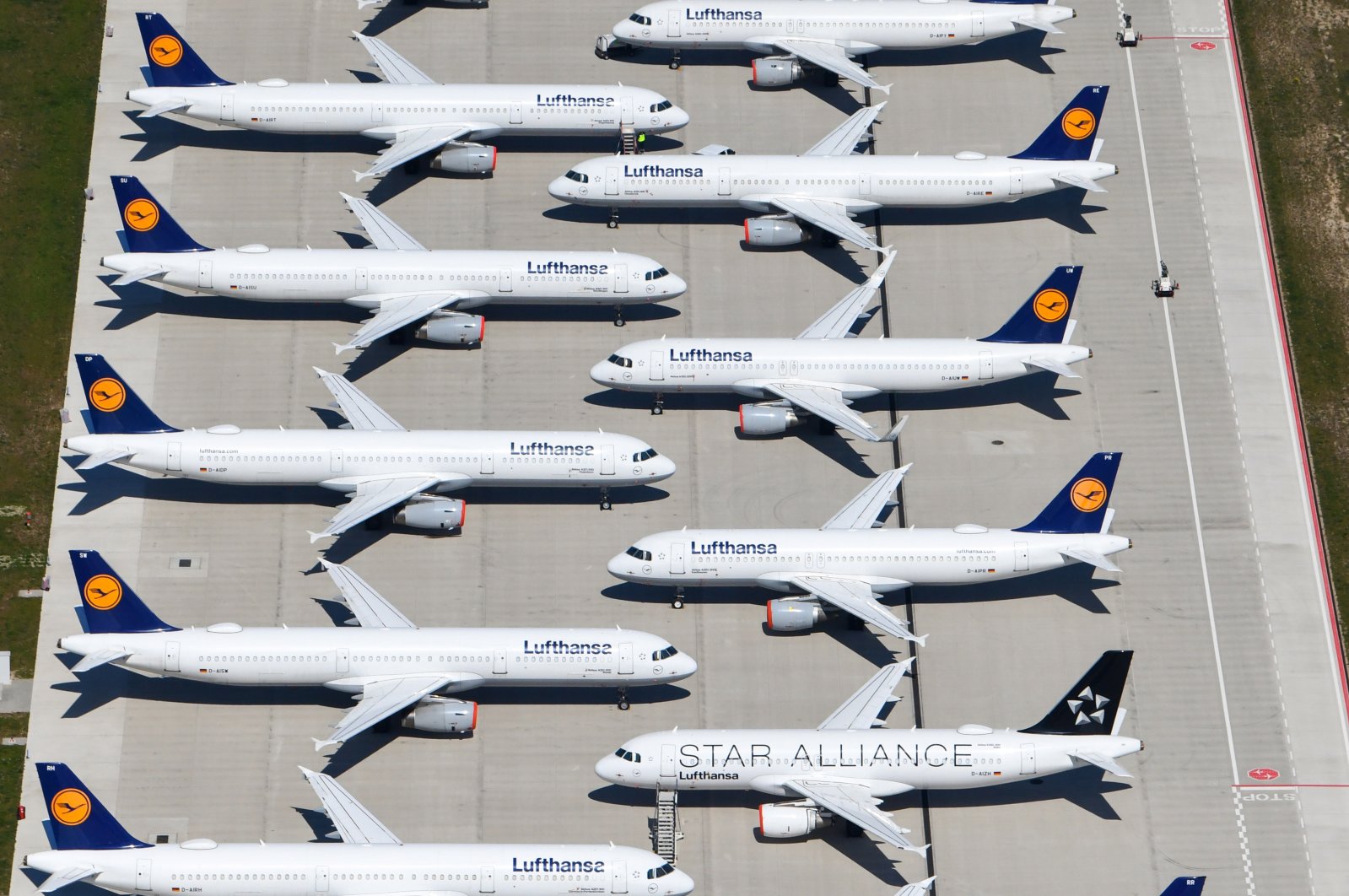 Lufthansa planes sit on the tarmac at the Berlin Brandenburg International Airport in Schoenefeld, Germany, April 23, 2020. (EPA Photo)