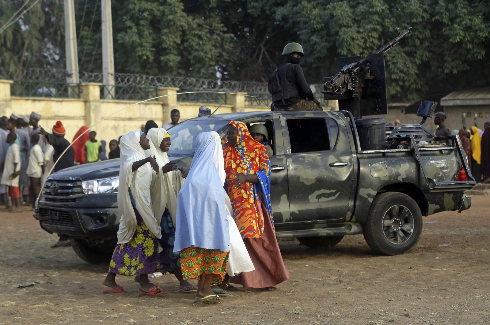 Parents are reunited with their daughters in Jangabe, Nigeria, Wednesday, March 3, 2021. (AP Photo)