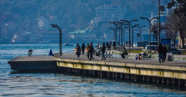 People enjoy sunny weather on a coastline in the Sarıyer district, Istanbul, Turkey, March 3, 2021. (Photo by Getty Images)