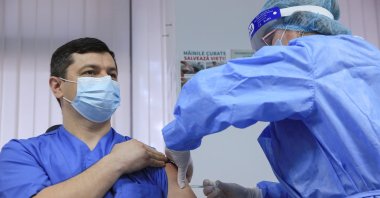 A man receives a dose of the AstraZeneca vaccine against the coronavirus disease at a hospital in Chisinau, Moldova March 2, 2021. (Reuters Photo)