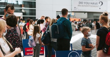 People wait for luggage claim at the Antalya International Airport, Antalya, southern Turkey, August 2020. (Shutterstock Photo)