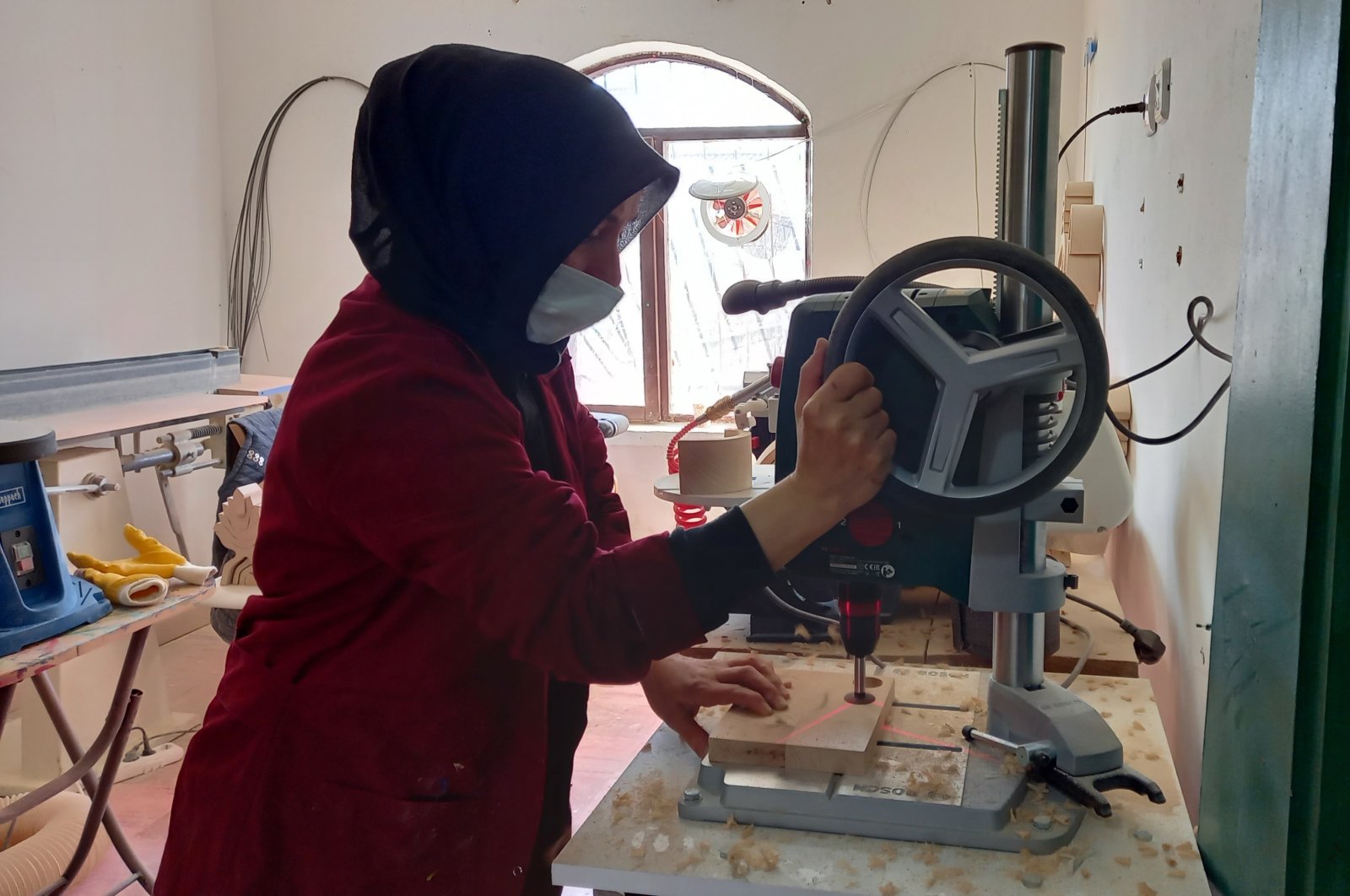 Emine Şimşek, an entrepreneur, works in her workshop where she produces and exports wooden toys, in Kırıkkale, central Turkey, Feb. 28, 2021. (IHA PHOTO) 