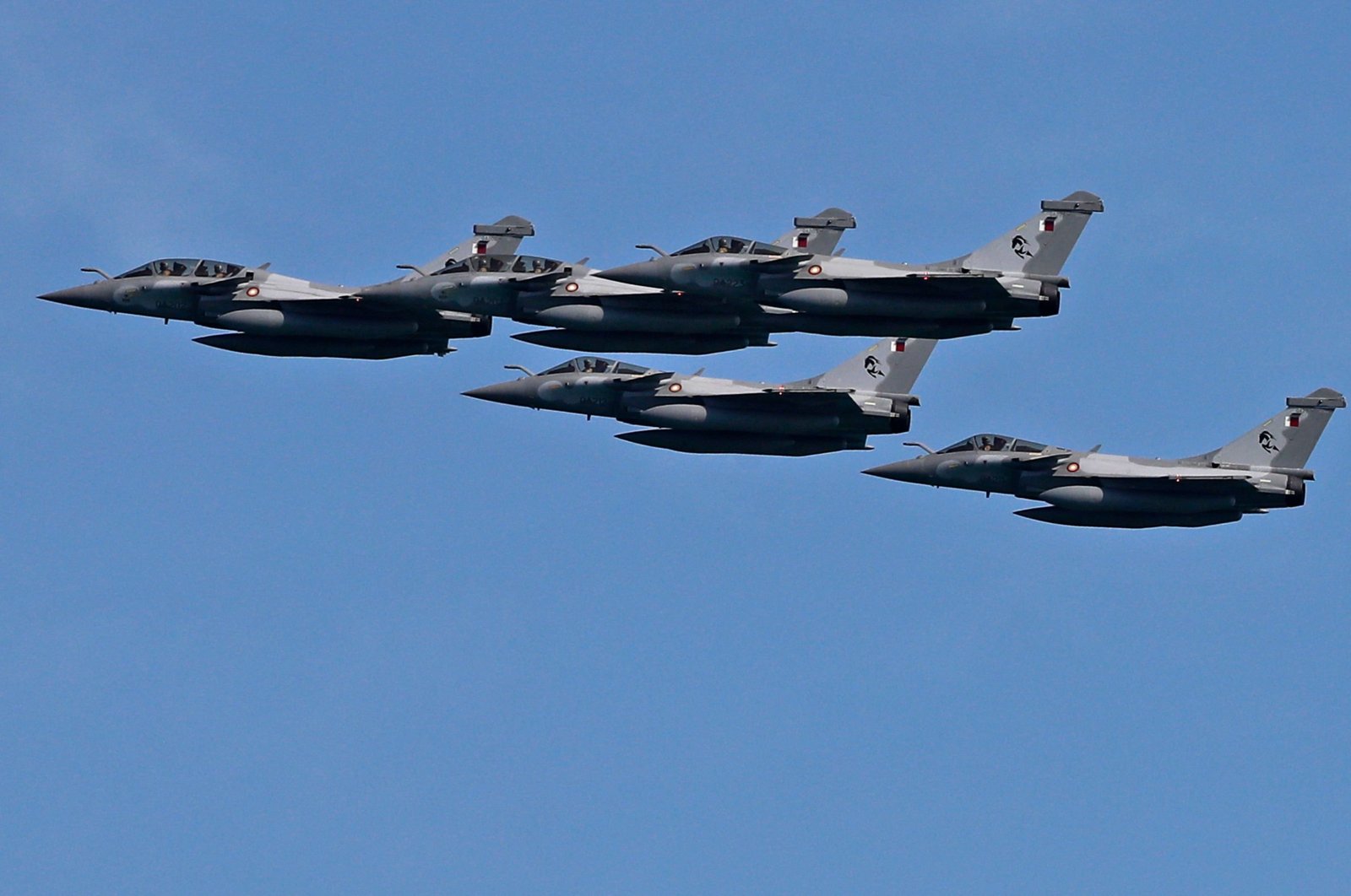 French-made Rafale fighter aircraft of the Qatar Air Force fly in formation during a military parade to mark Qatar's national day celebration, in the capital Doha, Dec. 18, 2020. (AFP)