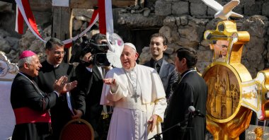 Pope Francis releases a white dove during a prayer for war victims at "Hosh al-Bieaa," Church Square, in Mosul's Old City, Iraq, March 7, 2021. (Reuters Photo)