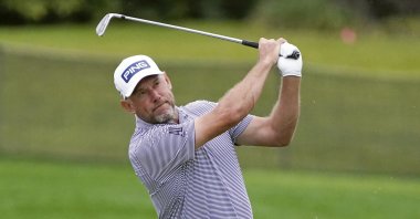 England's Lee Westwood hits a shot from the 16th fairway during the third round of the Arnold Palmer Invitational golf tournament in Orlando, Florida, March 6, 2021. (AP Photo)