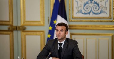 French President Emmanuel Macron reacts as he takes part in the Act-A videoconference meeting with the African Union board at the Elysee Palace, in Paris, on March 3, 2021. (AFP Photo)