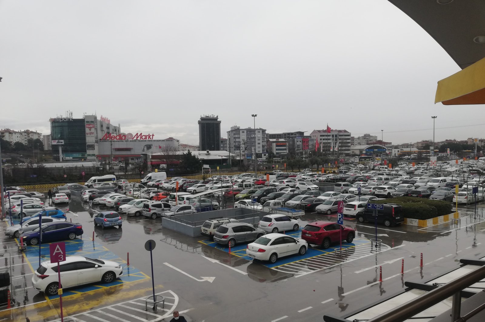 A shopping mall's parking lot is seen under rainfall in Northwestern Bursa province on March 6, 2021. (IHA Photo)