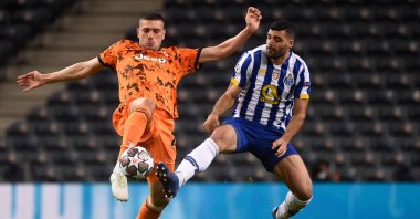Juventus' Turkish defender Merih Demiral (L) vies with FC Porto's Iranian forward Mehdi Taremi during the UEFA Champions League round of 16 first leg match at the Dragao stadium in Porto, Feb. 17, 2021. (AFP Photo)