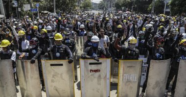 Demonstrators flash the three-finger salute during a protest in Yangon, Myanmar, March 8, 2021. (EPA Photo)