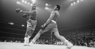 Boxer Muhammad Ali (R) steps away from a punch thrown by boxer Joe Frazier during their heavyweight title fight at Madison Square Garden, New York, U.S., March 8, 1971. (Getty Images Photo)