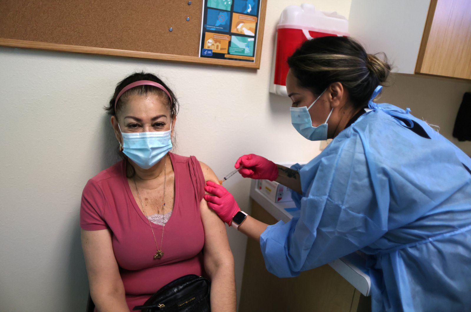 A woman receives a coronavirus disease (COVID-19) vaccination, at East Valley Community Health Center in La Puente, California, U.S., March 5, 2021. (Reuters Photo)