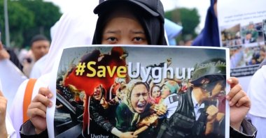 A woman takes part in a protest against China's treatment of Muslim Uyghurs at the Zero Point of the city of Yogyakarta, Indonesia, Dec. 21, 2018. (Shutterstock Photo)