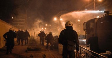 Police use a water cannon during clashes with protesters at a demonstration against police violence in an Athens suburb on March 9, 2021. (AFP Photo)