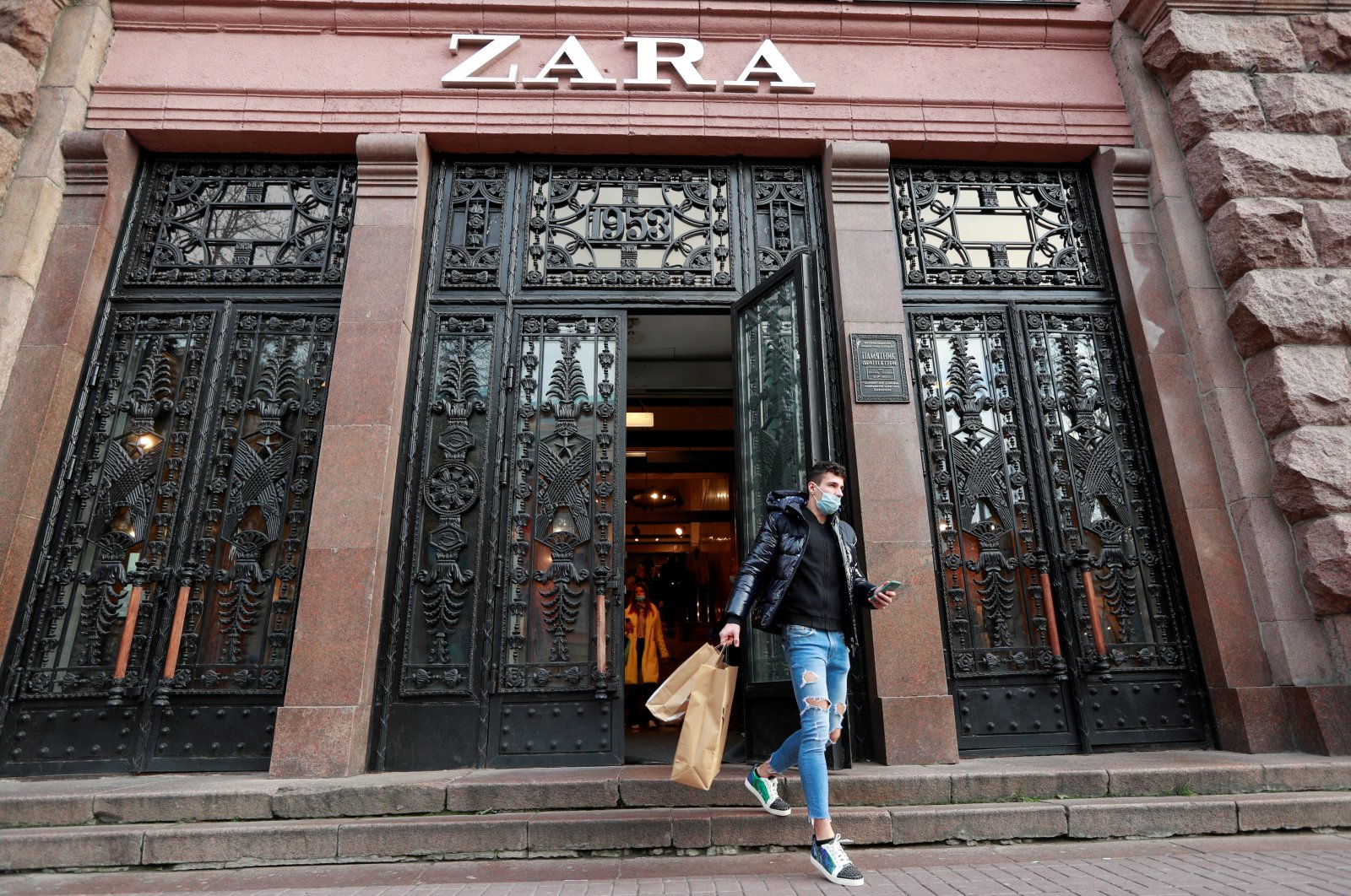 A man wearing a protective face mask walks out of a Zara store in central Kyiv, Ukraine, Nov. 25, 2020. (Reuters Photo)