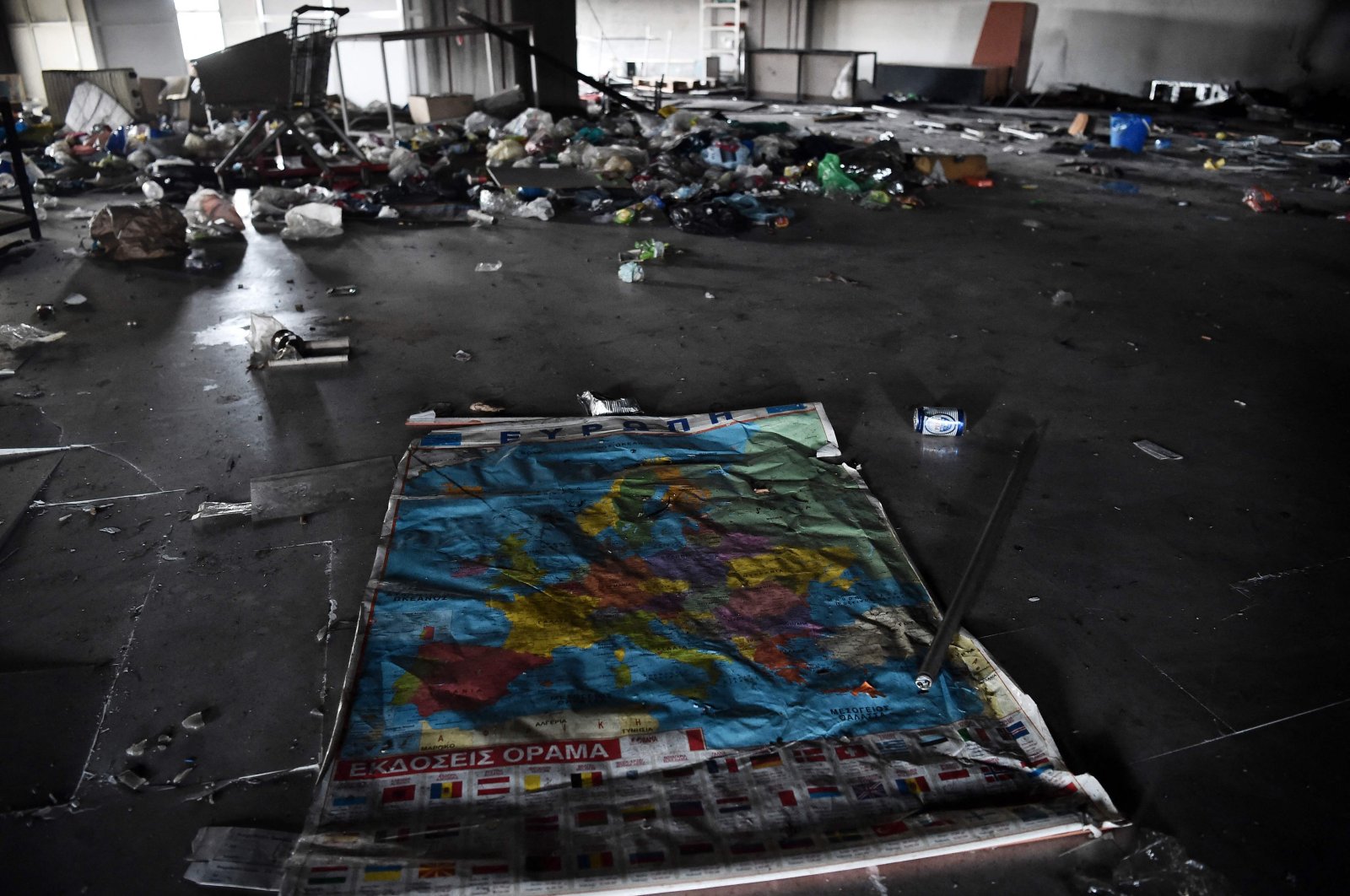 This photograph shows the inside of the burnt abandoned building where three migrants have been found dead following a fire in the center of Thessaloniki, Greece, March 10, 2021. (AFP)