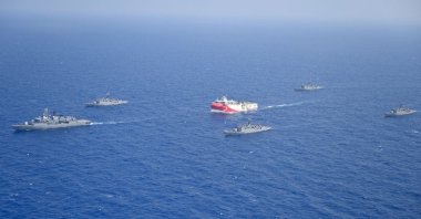Turkey's research vessel, Oruç Reis, in red and white, is surrounded by Turkish navy vessels as it was heading in the west of Antalya on the Mediterranean, Turkey, Aug 10, 2020. (AP Photo)