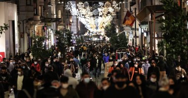 People wearing masks walk along Istiklal Street, the main shopping street in Istanbul, Turkey, March 10, 2020. (AA Photo)