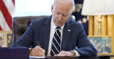 President Joe Biden signs the American Rescue Plan, a coronavirus relief package, in the Oval Office of the White House, in Washington, the U.S, March 11, 2021. (AP Photo)