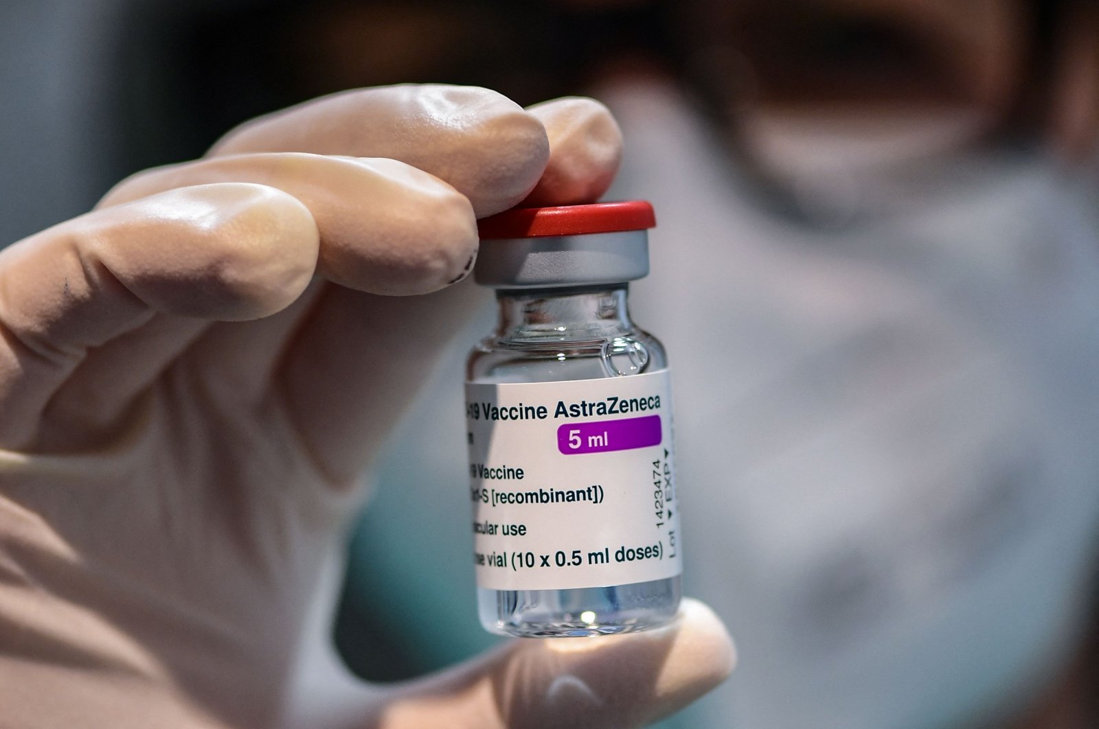 A medical worker holds a vial of the AstraZeneca/Oxford COVID-19 vaccine during a vaccination campaign at the National Museum of Science and Technology Leonardo Da Vinci, Milan, Italy, March 9, 2021. (AFP Photo)