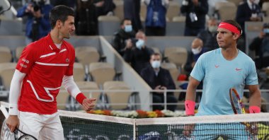 Novak Djokovic (L) and Rafael Nadal look at each other before the final match of the French Open tennis tournament at the Roland Garros stadium in Paris, France, Oct. 11, 2020. (AP Photo)