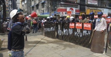 Anti-coup protesters gather with makeshift shields during a demonstration in Yangon, Myanmar, March 12, 2021. (AP Photo)