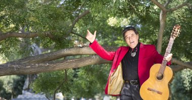 Erol Büyükburç poses with his guitar. (Archive Photo) 