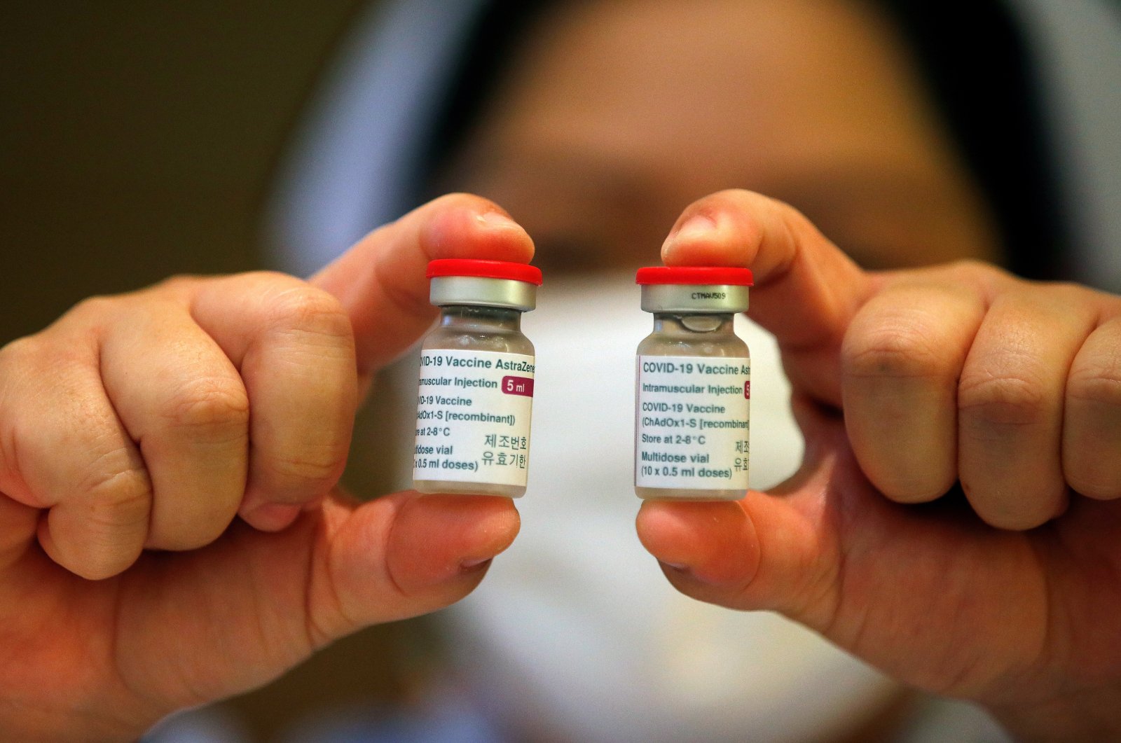 A Thai nurse displays vials of vaccine against COVID-19 developed by AstraZeneca after the cancelation and postponement of the vaccination event for the prime minister and cabinet ministers due to reports of side effects, at Bamrasnaradura Infectious Diseases Institute in Nonthaburi province, Thailand, March 12, 2021. (EPA Photo)