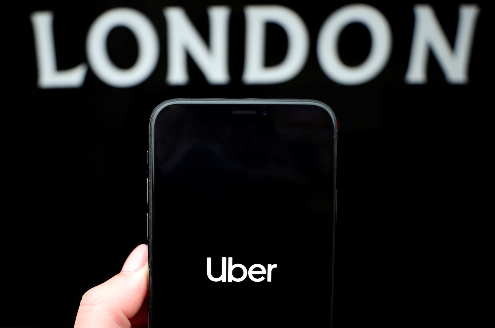 The Uber logo is displayed on a mobile phone in this picture illustration taken Nov. 25, 2019. (Reuters File Photo)