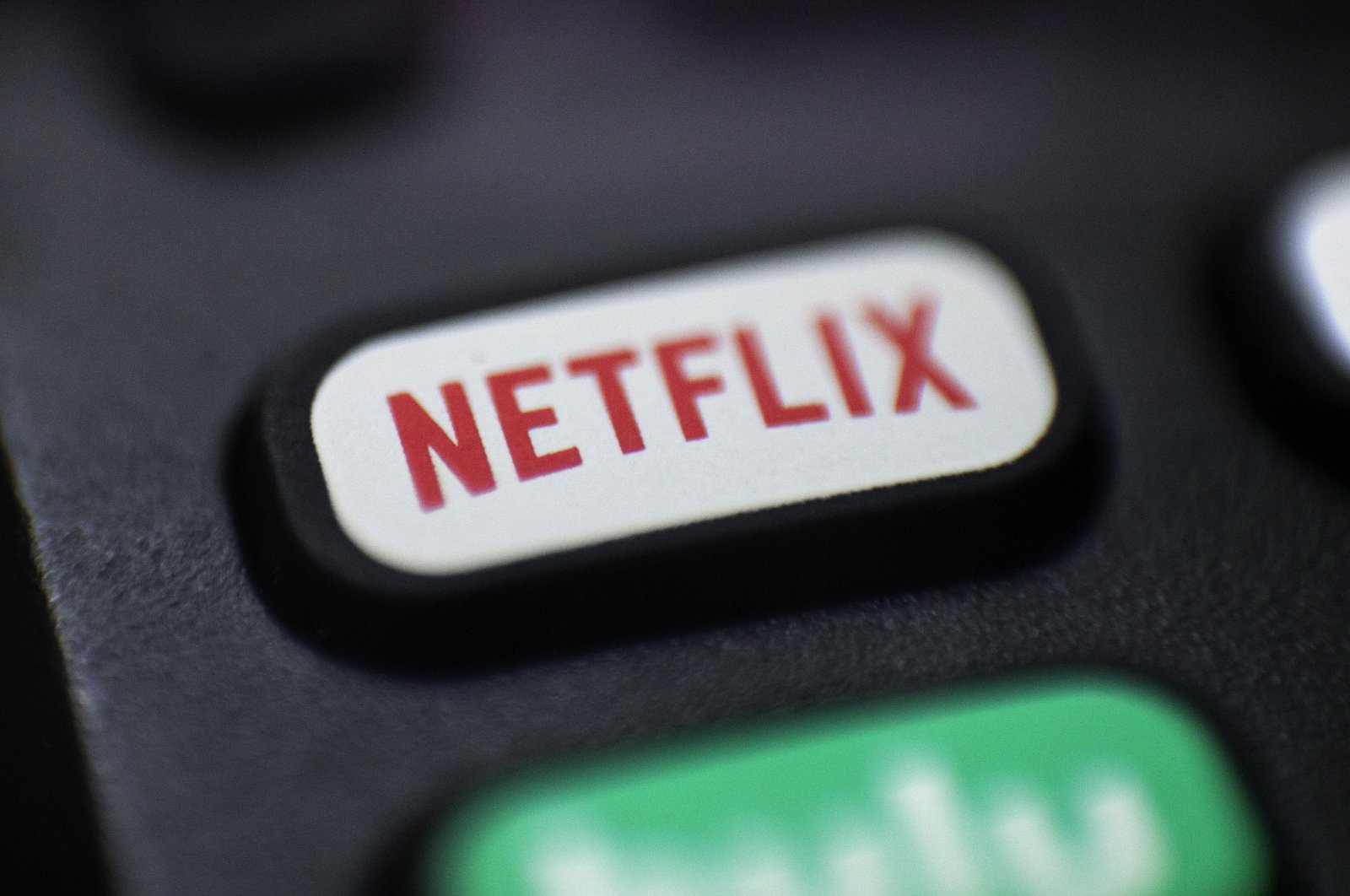 A logo for Netflix is displayed on a remote control in Portland, Ore., on Aug. 13, 2020. (AP File Photo)
