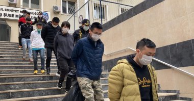 Turkish Police escort suspected gang members in Istanbul on Saturday, March 13, 2021 (DHA Photo)
