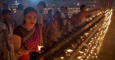 Hindu devotees light oil lamps during Lakshadeepotsava, the festival of a hundred thousand lamps, during the Shivarathri festival at the Basavanna Temple on the outskirts of Bangalore on March 11, 2021.(AFP Photo)