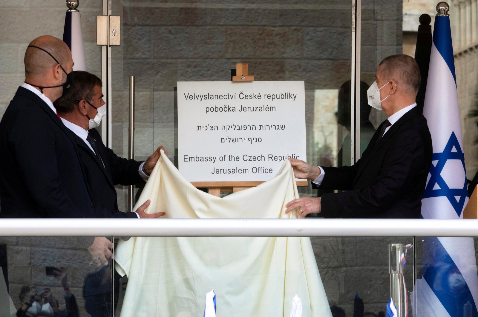 Czech Prime Minister Andrej Babis, Israeli Foreign Minister Gabi Ashkenazi and Israeli Public Security Minister Amir Ohana unveil a sign during an inauguration ceremony of a Czech diplomatic representation in Jerusalem, March 11, 2021. (Reuters)