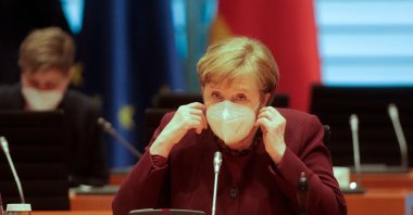 German Chancellor Angela Merkel wears a mask as she arrives for the weekly Cabinet meeting at the Chancellery in Berlin, March 10, 2021. (AFP Photo)