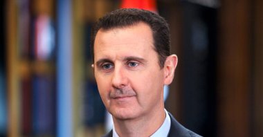 Syria's Bashar Assad speaks during an interview with Venezuela's state-run Telesur network, in Damascus, Syria, Sept. 25, 2013. (AP Photo)