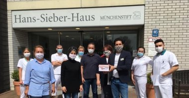 UID members, including Nevin Tekin (2nd L), deliver face masks to a nursing home in Munich, Germany. (Photo Courtesy of UID)