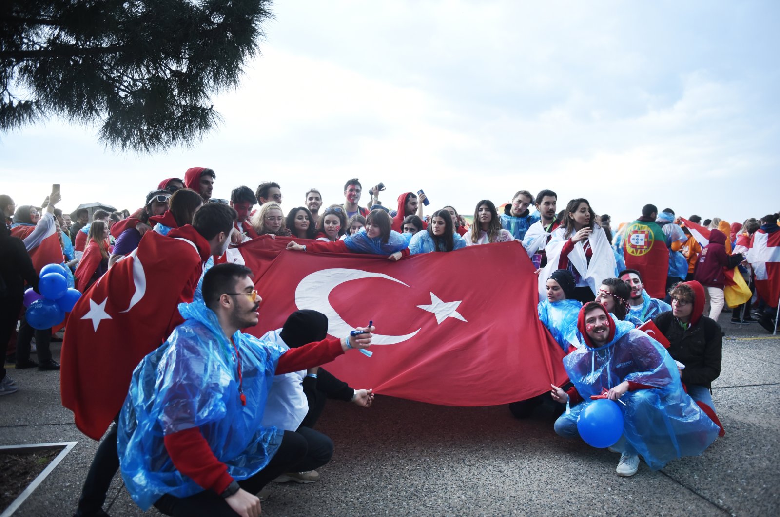 Turkish Erasmus students hold a Turkish flag during an annual Erasmus student meeting, in Thessaloniki, Greece, April 18, 2019. (Shutterstock Photo)