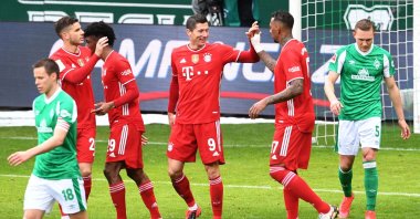 Bayern Munich's Polish forward Robert Lewandowski (C) celebrates with teammates during a Bundesliga match against Werder Bremen, Bremen, northern Germany, March 13, 2021. (AFP Photo)