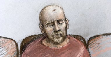 Court artist sketch by Elizabeth Cook, showing serving police constable Wayne Couzens, making his first appearance at the Old Bailey court by video link from Belmarsh top security jail where he is charged with the murder and kidnapping of Sarah Everard in south London, Tuesday March 16, 2021, . (AP Photo)