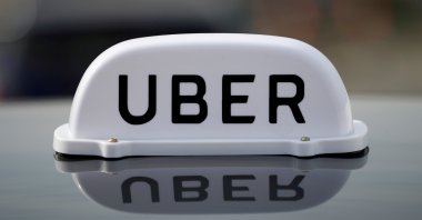The logo of taxi company Uber is seen on the roof of a private hire taxi in Liverpool, U.K., April 15, 2019. (Reuters Photo)