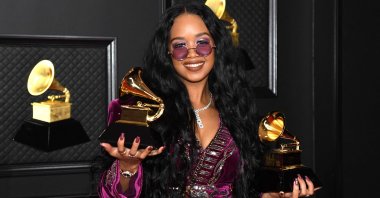 H.E.R., winner of the Best R&B Song and the Song of the Year awards poses in the media room during the 63rd Annual Grammy Awards in Los Angeles, California, U.S., March 14, 2021. (AFP)