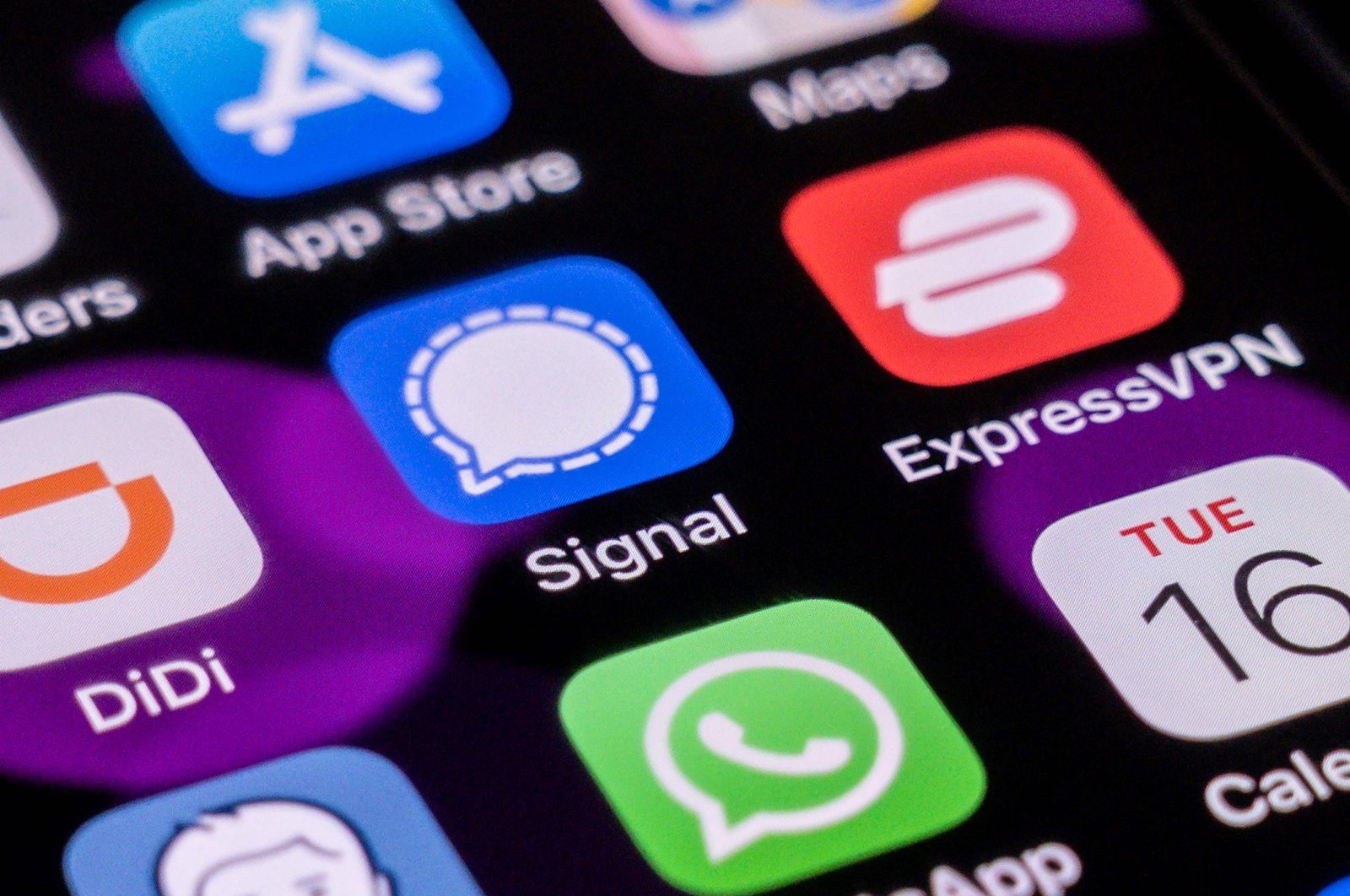 The encrypted messaging app Signal (C) can be seen on a smartphone home screen in Beijing, China, March 16, 2021. (AFP Photo)