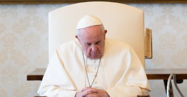 Pope Francis holding a livestreamed weekly private audience in the library of the Apostolic Palace in The Vatican, March 17, 2021. (AFP)