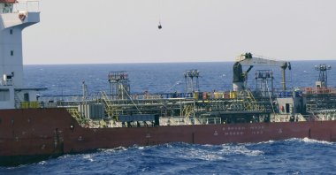 A boarding team boards the Merchant Vessel Royal Diamond 7, in international waters, 150 kilometers (93 miles) north of Derna, Libya, Sept. 10, 2020. (AP Photo)