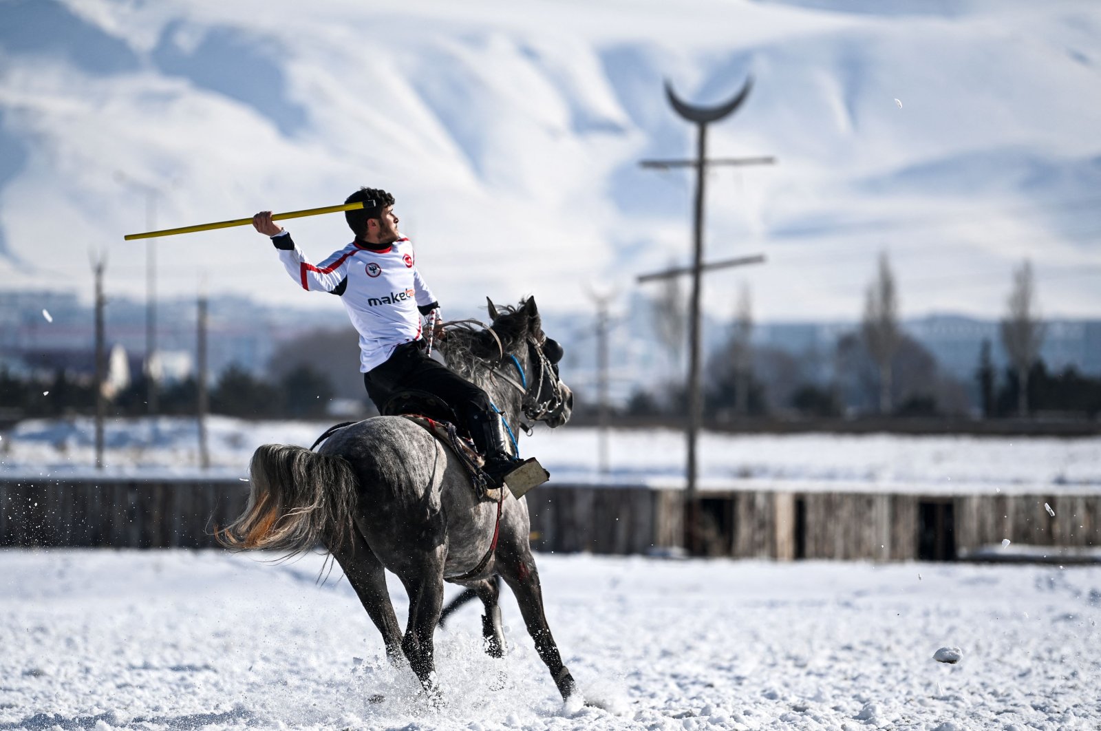 A competitor prepares to throw a javelin toward an opponent during the Turkish game of cirit between Uzmanlar Sports Club and Dadaş Sports Club, Erzurum, eastern Turkey, March 5, 2021. (AFP Photo)