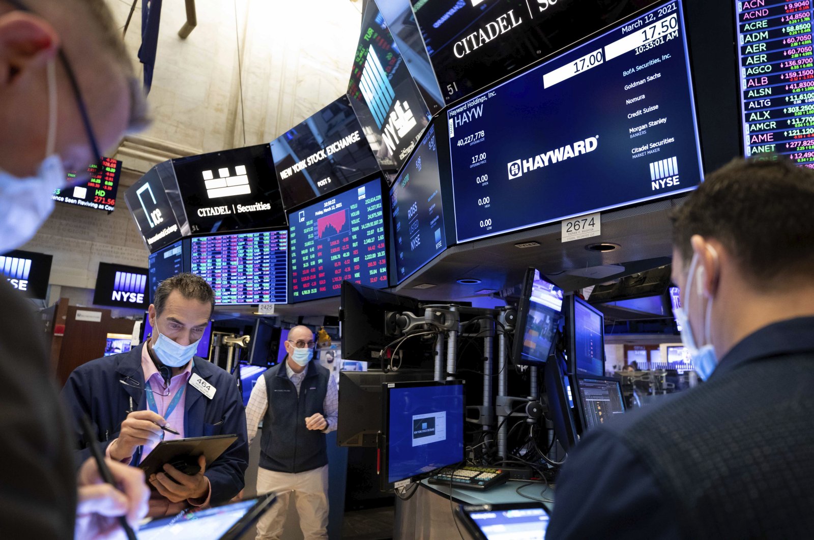 Traders work on the trading floor of the New York Stock Exchange in New York City, March 12, 2021. (NYSE via AP)